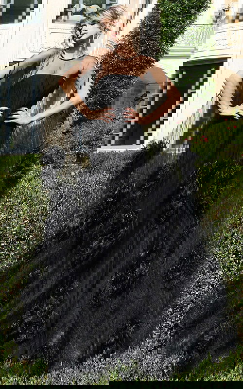 Sheer tulle gown with strapless bodice and floral appliqués