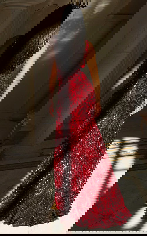 Deep V-neck sequin gown with floral beading and high slit