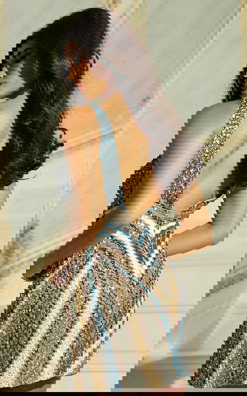 Back view of fitted beaded short dress with chevron pattern