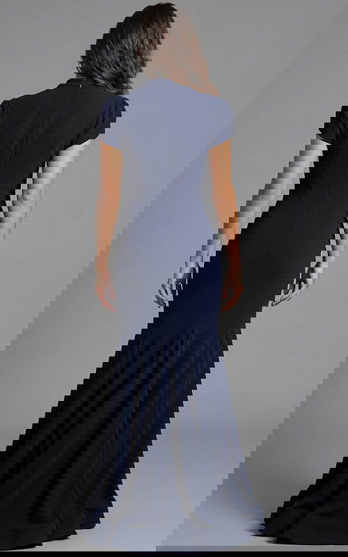 Back view of fitted gown with smooth silhouette and flowing hem