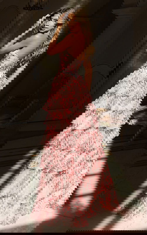 Strapless floral dress featuring layered ruffles and high slit